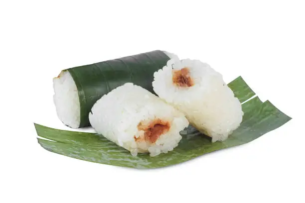 Lemper is a snack made from sticky rice, usually filled with shredded or chicken meat. lemper isolated on white background