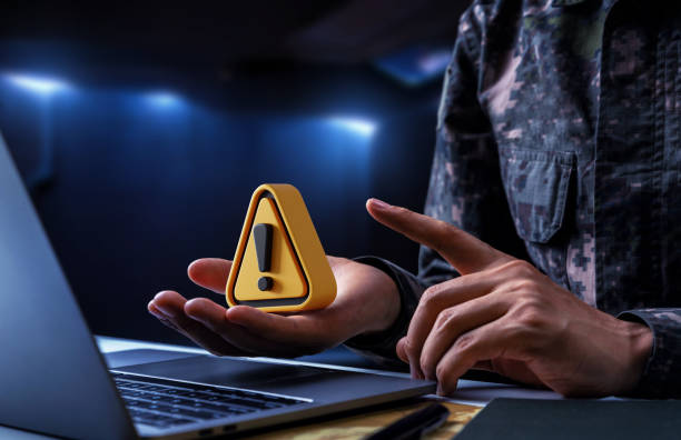 Warning sign on hand of soldier, Fake news and information operations stock photo
