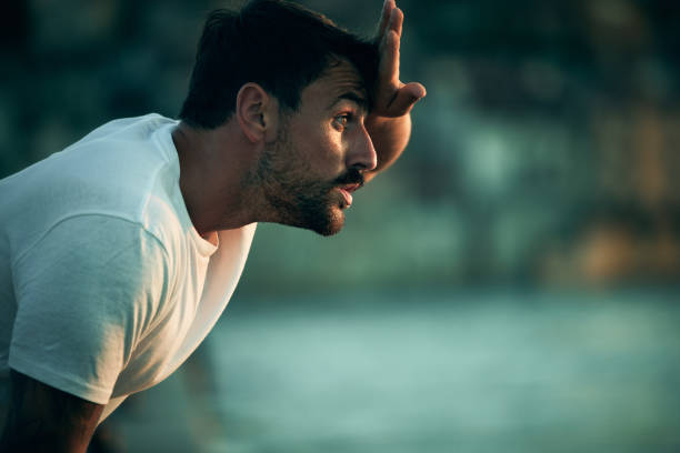 istock Young male athlete taking a break from sports training. 1428272285