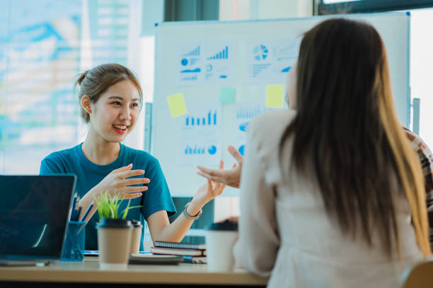 istock Asian creative teams sit and work together to share inspirational creativity in a workshop. Young modern businessmen are meeting with graph paper and laptop in the workplace. 1428272819