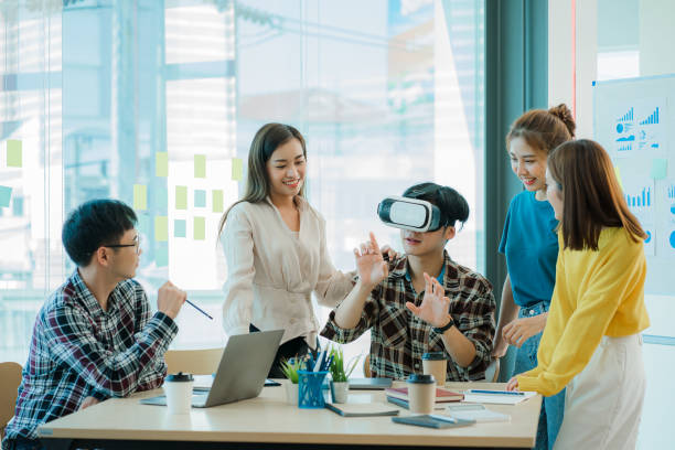 istock Asian creative teams sit and work together to share inspirational creativity in a workshop. Young modern businessmen are meeting with graph paper and laptop in the workplace. 1428273402