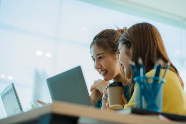 istock Asian creative teams sit and work together to share inspirational creativity in a workshop. Young modern businessmen are meeting with graph paper and laptop in the workplace. 1428273447
