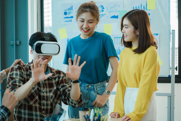 istock Asian creative teams sit and work together to share inspirational creativity in a workshop. Young modern businessmen are meeting with graph paper and laptop in the workplace. 1428273745