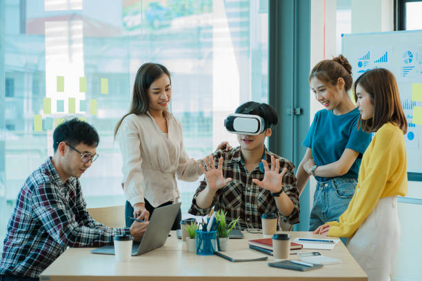 istock Asian creative teams sit and work together to share inspirational creativity in a workshop. Young modern businessmen are meeting with graph paper and laptop in the workplace. 1428273907