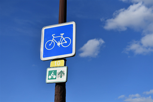 Paris, France-09 18 2022: Road sign designating a cycle path in a street of Paris, France.