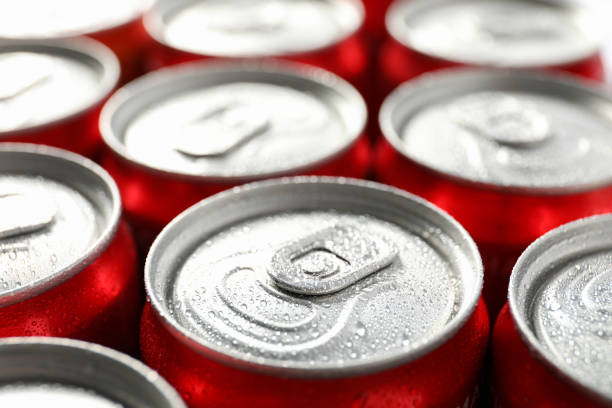 istock Cans with soda all over background, close up 1428275397