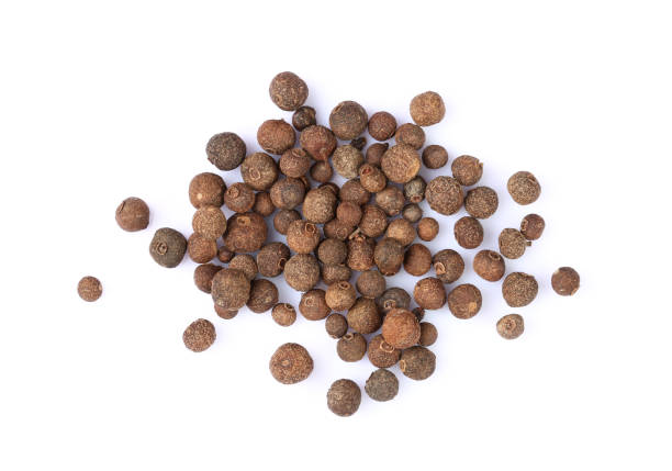 istock Heap of black peppercorns isolated on white background 1428276260