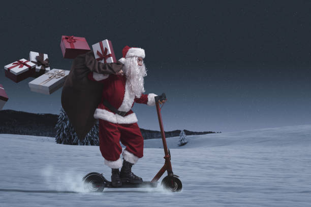 Santa Claus riding a scooter and delivering gifts stock photo