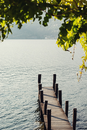 Empty wooden jetty on Lake Orta, Italy