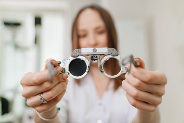 istock ophthalmologist with trial frame for selection of glasses. selective focus 1428285482