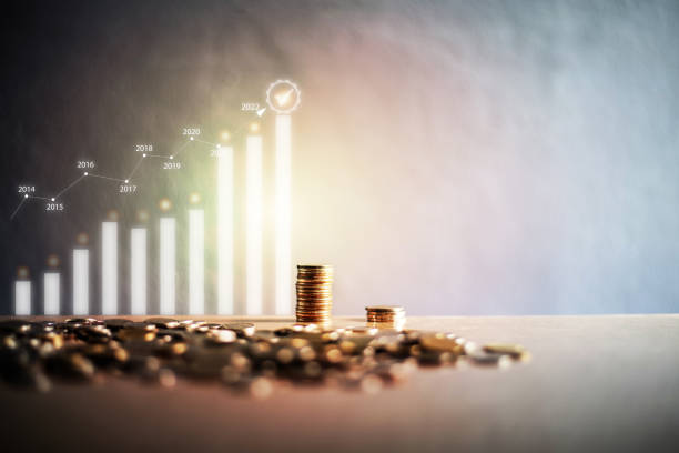istock stacking coins with a graph of profit. Business successful growth. 1428290881