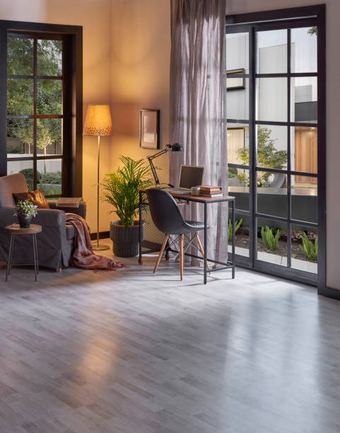 istock Modern rom with working table and armchair style, parquet floor, frame lamp decor, curtain, garden view house interior. 1428293047
