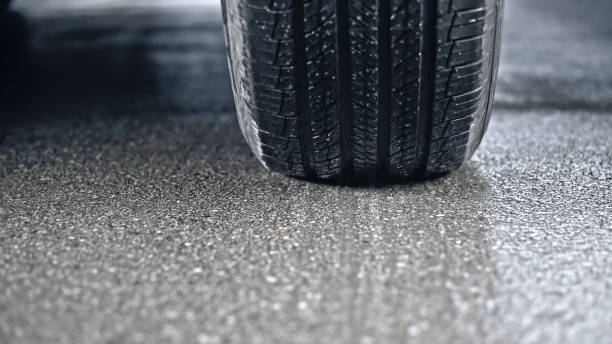 istock Tire of car driving on road 1428297218