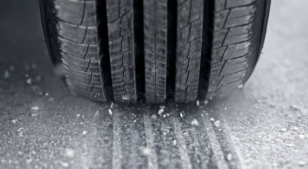 istock Dust splashing from tire of car driving 1428297317