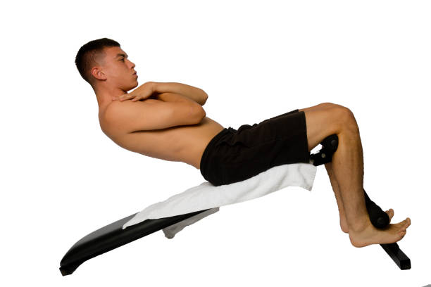 istock Nineteen year old teen boy doing situps 1428304870