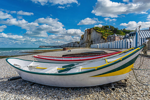 Fishing boats with fishing equipment at the beach near cliffs of Yport in Normandy, France