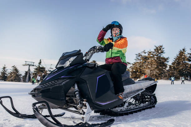 istock Woman on snowmobile 1428318514