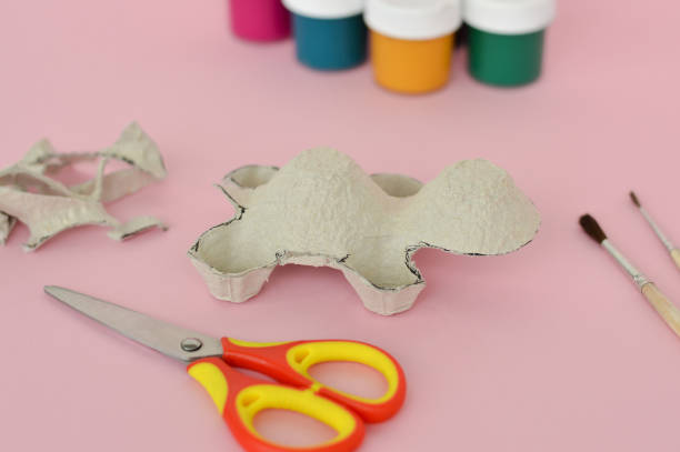 istock Step by step diy process. Step 3- we cut out a turtle figurine from an egg cardboard box. Creativity, crafting. Zero waste concept. 1428318700
