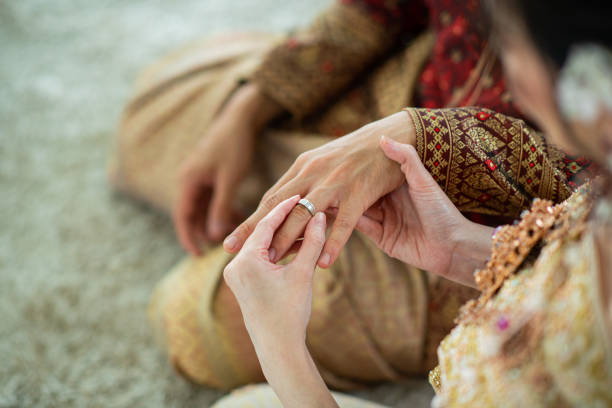 istock wear a ring, wedding ring, love couple 1428319386