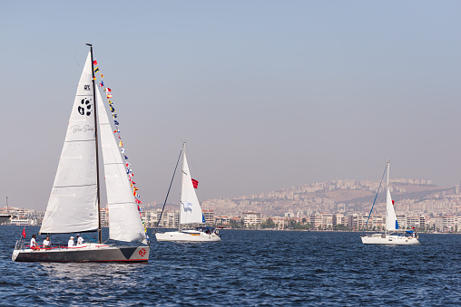 Izmir, Turkey - September 9, 2022: Sailing boats over the sea on celebrations of the liberty day Izmir on September 9 2022