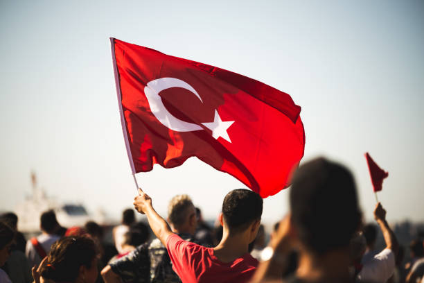 Close up shot of a  Turkish flag in the crowded people on the liberty day of Izmir at Izmir Konak Turkey stock photo