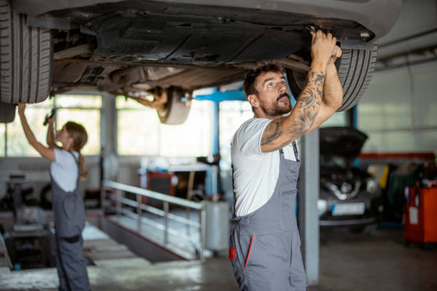 istock Group of Mechanic Under the Car 1428327276