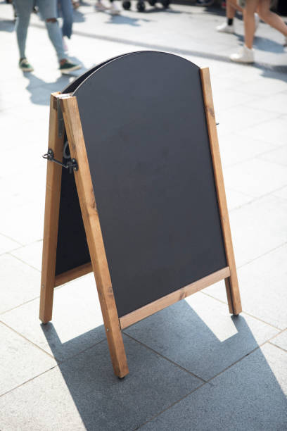 istock A-board on a London pavement with pedestrians 1428331240