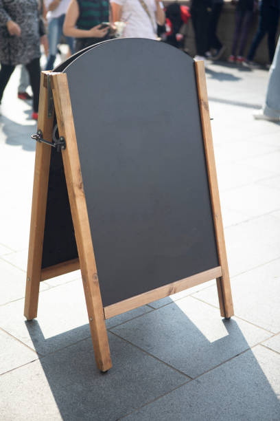 istock A-board on a London pavement with pedestrians 1428331245