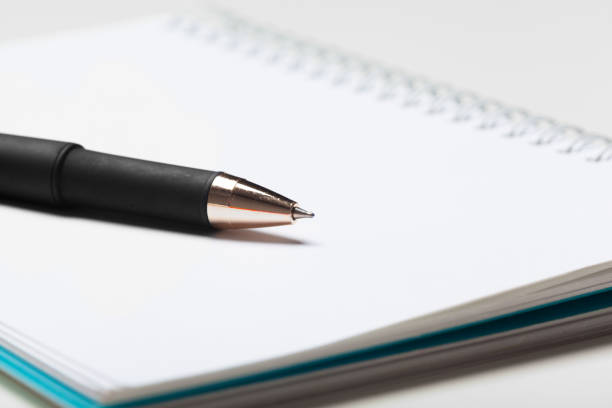 Close-up of a planer notebook (Personal organizer) and a pen.