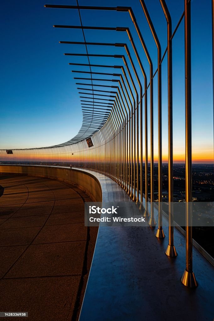 Breathtaking city view from the viewing platform of Olympiaturm in Munich, Germany at dusk A breathtaking city view from the viewing platform of Olympiaturm in Munich, Germany at dusk Architecture Stock Photo