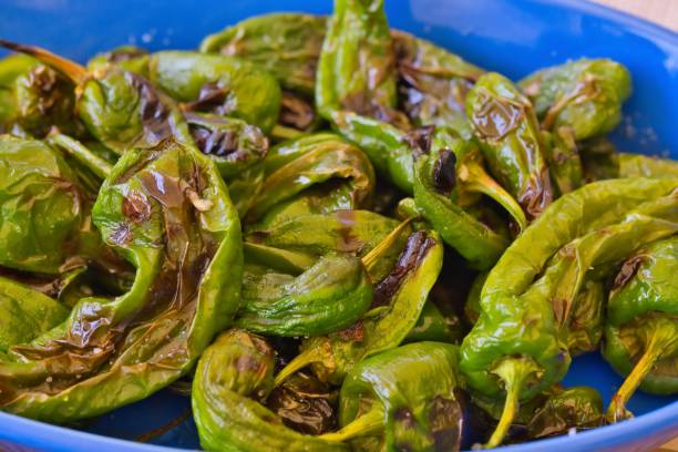 istock fried small green peppers with olive oil, 1428338958