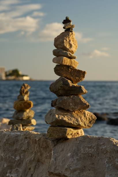 istock Stapled rocks with ocean background with selected focus and selected blur 1428340540