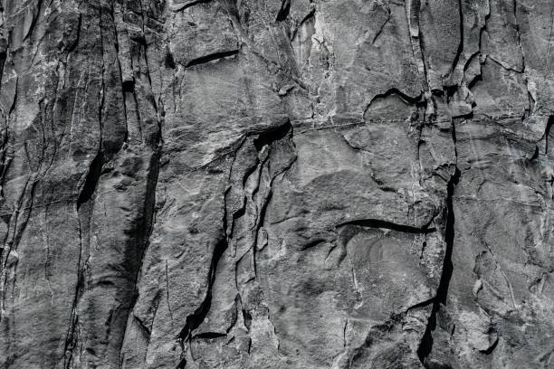 istock Grayscale view of a rocky slope - rough surface background 1428342963