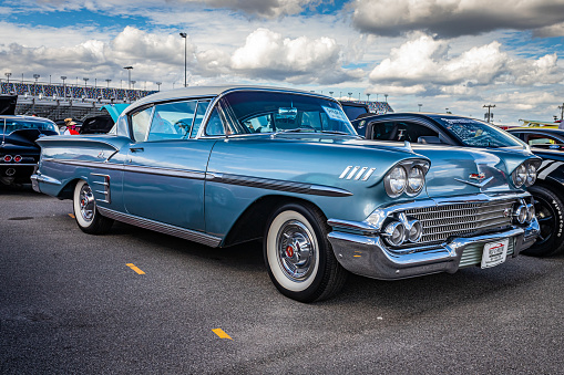 Daytona Beach, FL - November 28, 2020: Low perspective front corner view of a 1958 Chevrolet BelAir Impala Sport Coupe Hardtop at a local car show.