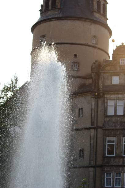 istock Water fountain in front of an ancient building 1428345507