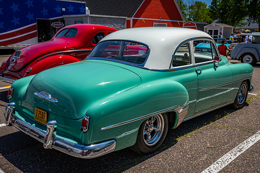 Falcon Heights, MN - June 18, 2022: High perspective rear corner view of a 1952 Chevrolet Styleline Deluxe 2 Door Sedan at a local car show.