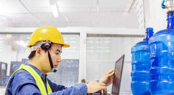 istock engineer working in drink water plant using a tablet computer to check and repair boiler water to the water system  in factory 1428349249