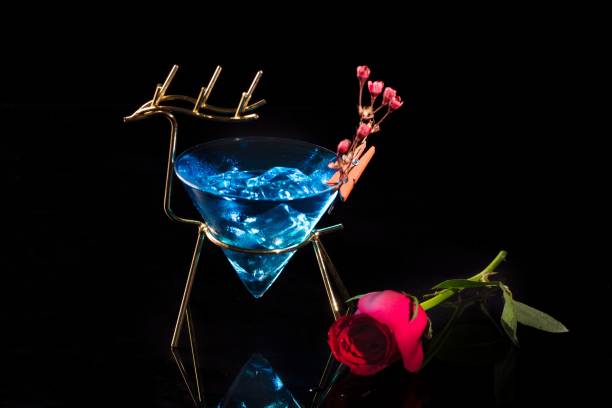 istock Blue ocean Cocktail and a red rose on a black background 1428350201