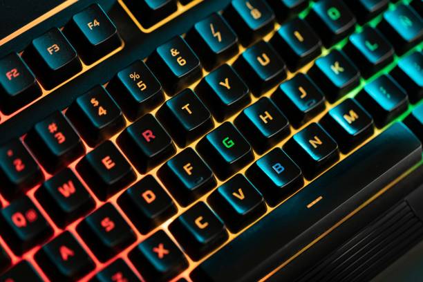 istock Colorful light keyboard with red orange and green backlight. 1428353078