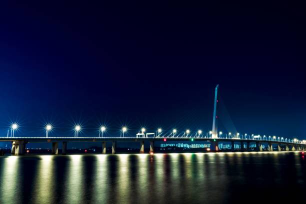 istock Illuminated Shenzhen Bay Bridge on blue sky background at night, long exposure 1428357261