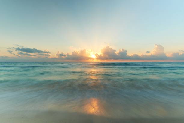 istock Pastel sunset sky over a beautiful seashore 1428357924