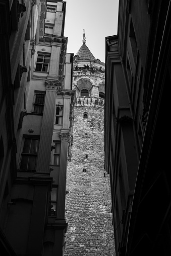 A vertical of the Galata tower from a low angle in black and white.