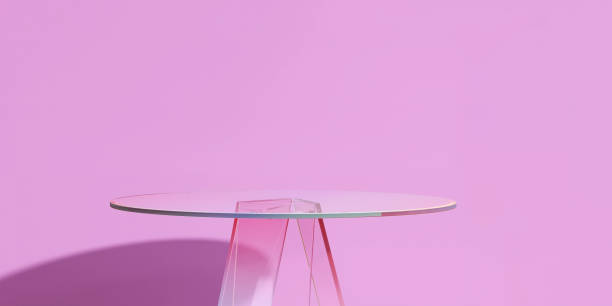 Modern and minimal glass smooth round podium side table in sunlight on purple pink wall background