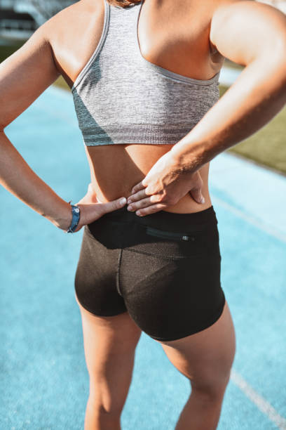 istock Athletic Female Dealing With Backache On Sports Track 1428360714