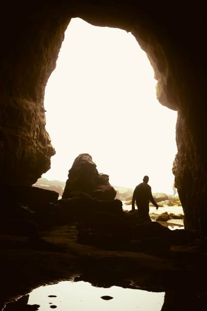 istock Silhouette of lonely man exploring caves 1428361949