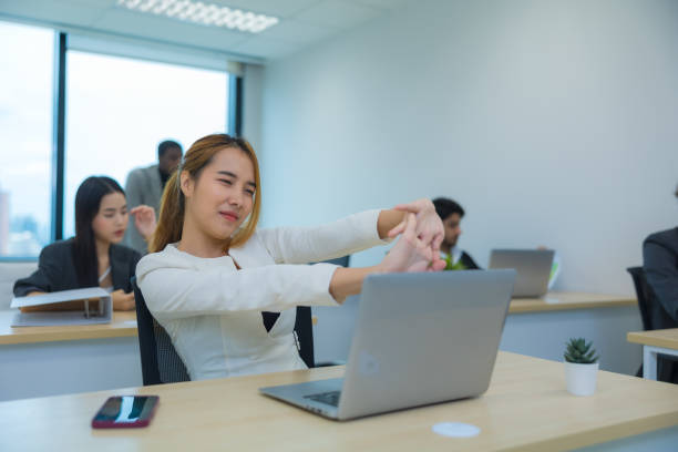 istock Exhausted Asian woman feeling sick, tired, exhuasted while working on table in office. 1428370112