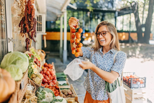 istock A woman at a vegetable stand 1428371848
