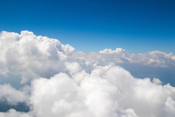 istock White soft and fluffy clouds in the blue sky - dreamy background 1428380443