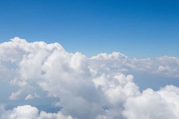 istock White soft and fluffy clouds in the blue sky - dreamy background 1428380444