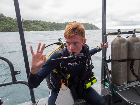 Puntarenas, Costa Rica - September 09, 2022: Young diver prepared for the dive in Pacific waters